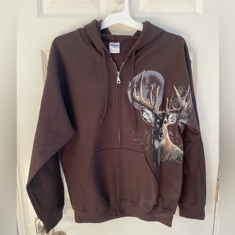 Boys size M zip hoodie with Buck on front.